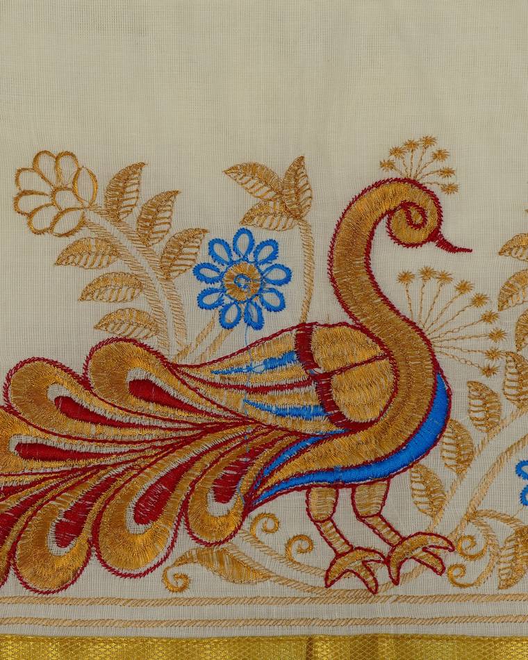 Cream fabric with peacock embroidery