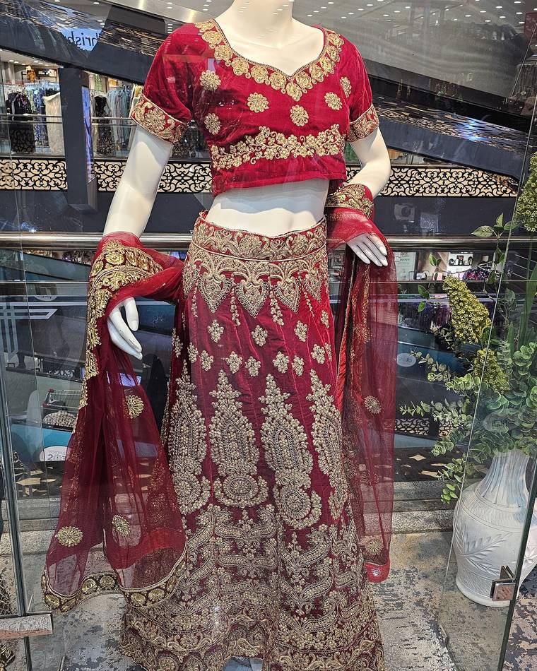 Red bridal lehenga on a mannequin