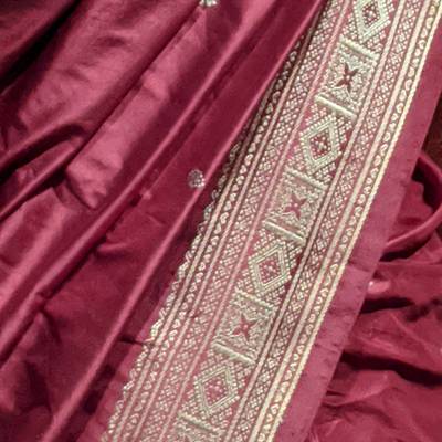 Maroon silk with a woven gold border